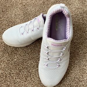 Women’s memory foam wide fit sketcher tennis shoes.